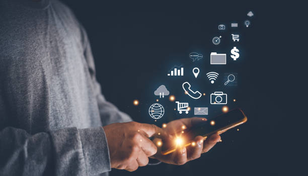 Man using smartphone for multimedia application, data search, stock trading analysis, location search, phone, chat and email communication, financial information, mobile banking,
image recording.