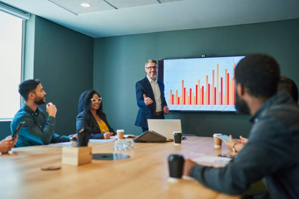 Business people discussing ideas in a meeting room Business people discussing ideas in a meeting room