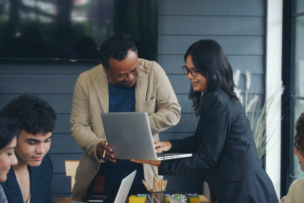 I4 Group of business people plan annual budget report and work to solution strategy during brainstorming meeting. Collaborate of Professional Businessman and team at office. Strategy Business concept.